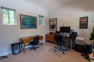 Carpeted office with baseboards