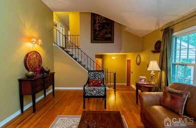 LIVING ROOM FACING THE ENTRYWAY OF PROPERTY AND ST