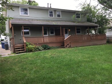 Two sided wood deck with covered roof