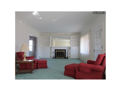 Living room has beautiful built-ins and lovely fireplace!