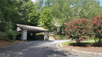 Home and carport from cul-de-sac showing roundabout