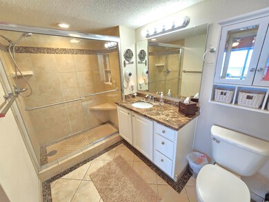Bathroom featuring toilet, tile patterned flooring