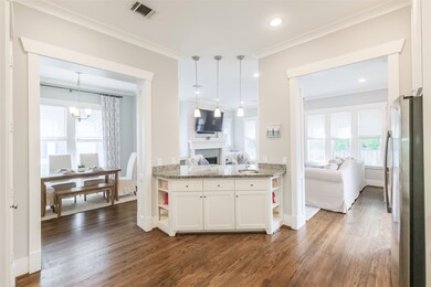 The island has a second sink, breakfast bar and ex