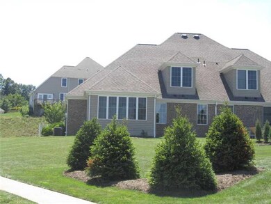 Exterior Back. Additional sunroom in rear with pat