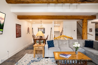 Living room with hardwood / wood-style floors and
