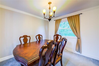 Great sized dining room w/ gray accent wall and cr