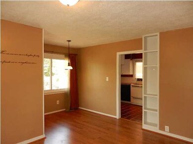 Built in Shelves border the Wall of Kitchen Entran