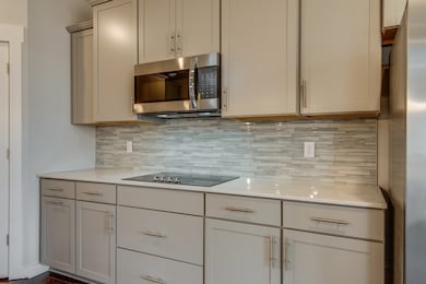 Stainless steel appliances (including refrigerator) are in this home