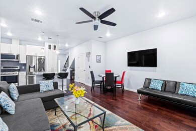 Living area with dark wood-type flooring, ceiling