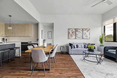 Dining area featuring dark wood-type flooring, ce