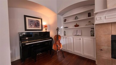 Featuring built in cabinets in living room
