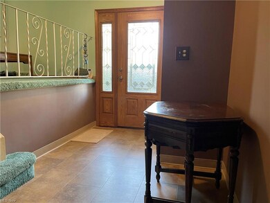 Foyer Features Newer Front Door