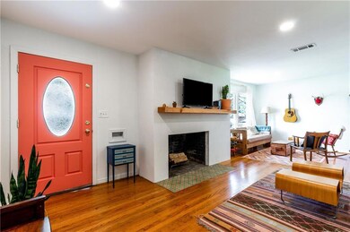 Beautiful wood-burning fireplace in living room.