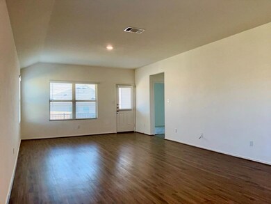 Empty room featuring dark wood-type flooring and 