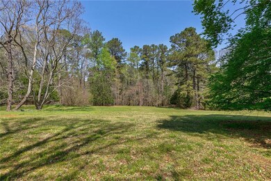 View of yard featuring a view of trees