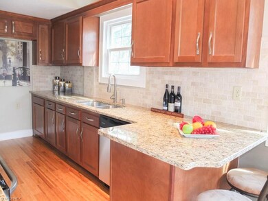 Remodeled kitchen has new cabinets, granite counte