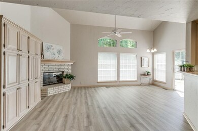 The living/dining area has high ceilings, lots of 