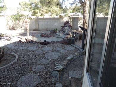 inviting backyard and waterfall