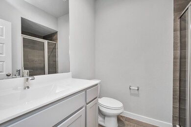 Full bath down stairs with walk in shower. Sample