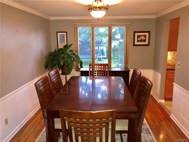 Formal dining room with beautiful hardwood floors.