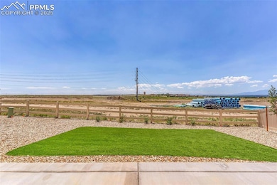 View of yard featuring a rural view and fence
