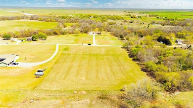 Birds eye view of property with a rural view