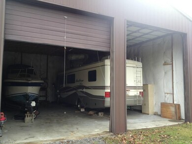 A toy lovers dream garage . With 14 foot overhead 