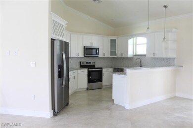 Kitchen featuring stainless steel appliances, a pe
