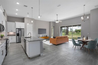 Open concept great room w/ a light and bright kitchen.