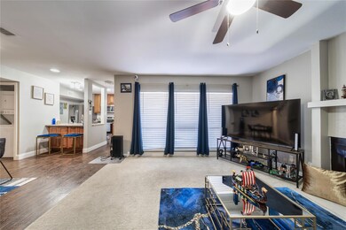 Living room with hardwood / wood-style flooring