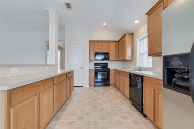 The kitchen has plenty of counterspace and storage.