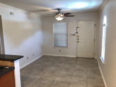 Unfurnished dining area with a ceiling fan, light