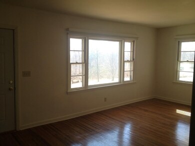 Large Living room with picture window overlooking 