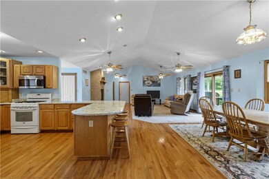 HARDWOOD FLOORS FLOW THROUGHOUT THE ENTIRE FIRST FLOOR. A CUSTOM CARPETED AREA WAS INSTALLED WITHIN THE HARDWOODS OF THE FAMILY ROOM FLOOR.