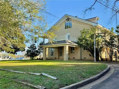 View of front of property featuring a balcony and