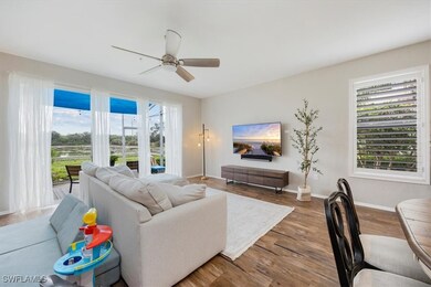 Living area with a ceiling fan, wood finished floo