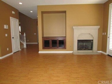 Fireplace and built-in cabinet in the Family Room.