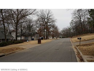 Exterior Front. Neighborhood View, curbed and gutt