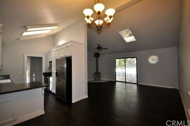 Open floor plan with skylights, new flooring and a