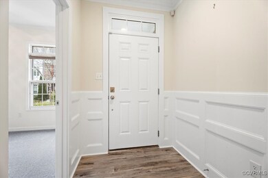 Doorway to outside with dark wood-style floors, wa