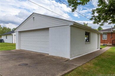 Two car oversized garage accessed off Alice.