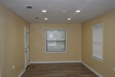 Empty room with dark wood-type flooring