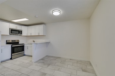 Kitchen with appliances with stainless steel finis
