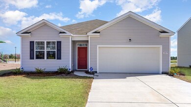 View of front facade featuring a garage and a fron