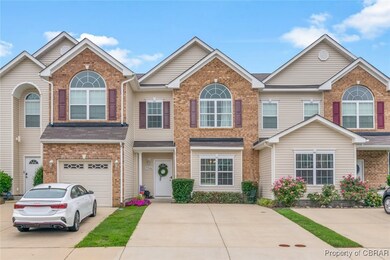 FRONT OF HOME WITH PAVED DRIVEWAY