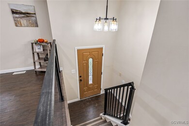 Foyer entrance with dark wood-type flooring