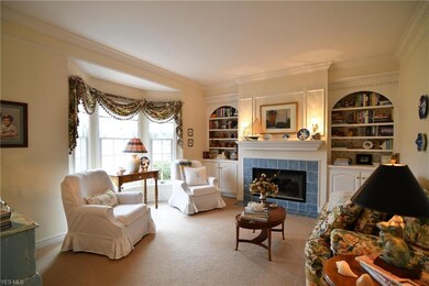11557 Geib Ave NE Hartville, formal living room with its own fireplace and built- in bookcases
