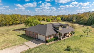 View from above of property with a heavily wooded area