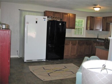 Large eat-in kitchen. Black refrigerator stays. Wh