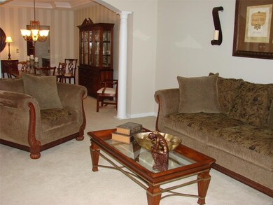 Formal Living Room opens into the Formal Dining Ro